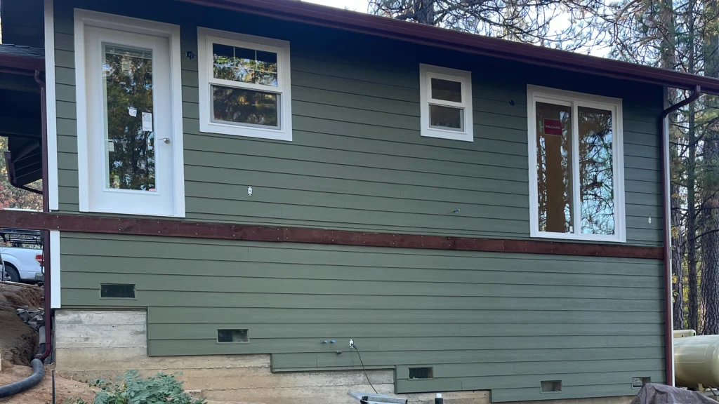 Engineered wood siding with dark brown trim on residential home in Des Moines Iowa by Black Ridge Contracting